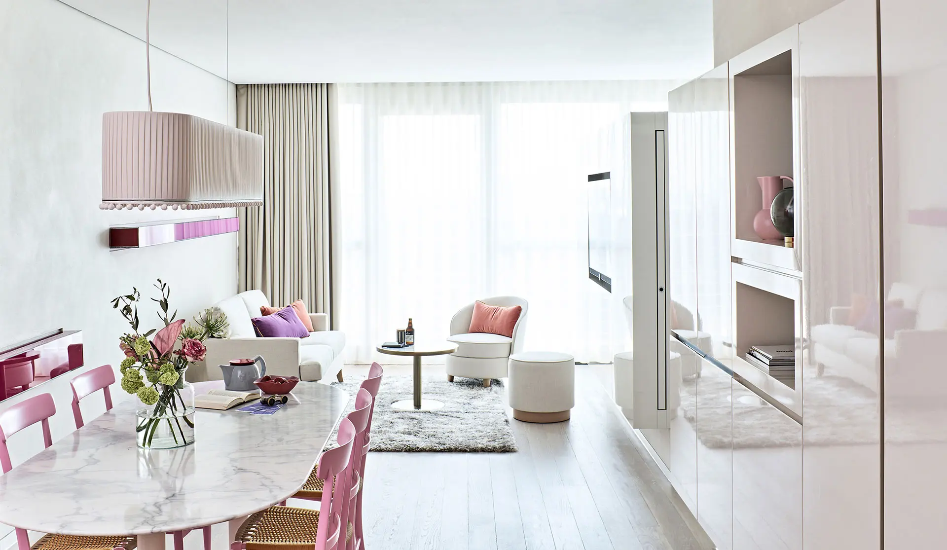 Rectangular pink pleated-fabric pendant above a marble table