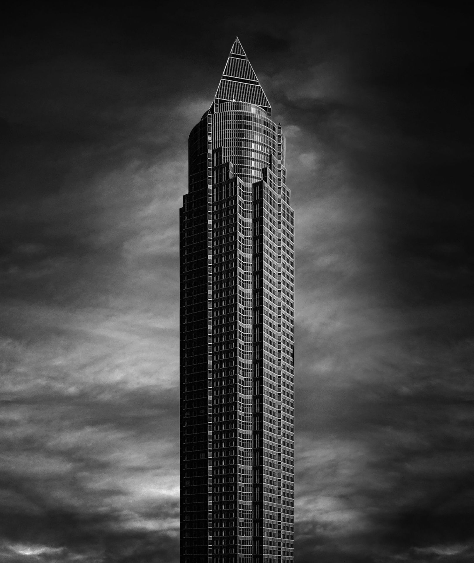 Helmut Jahn's Messeturm tower in Frankfurt, photographed from below against the sky