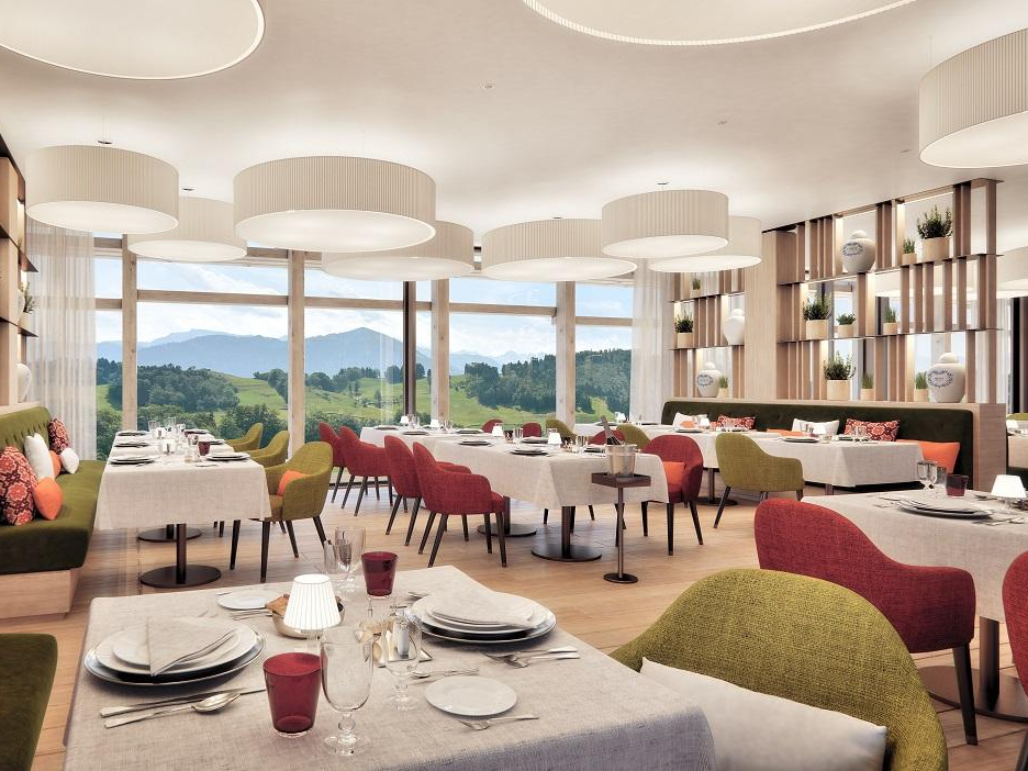 Drum pendant lights in a hotel restaurant with mountain views