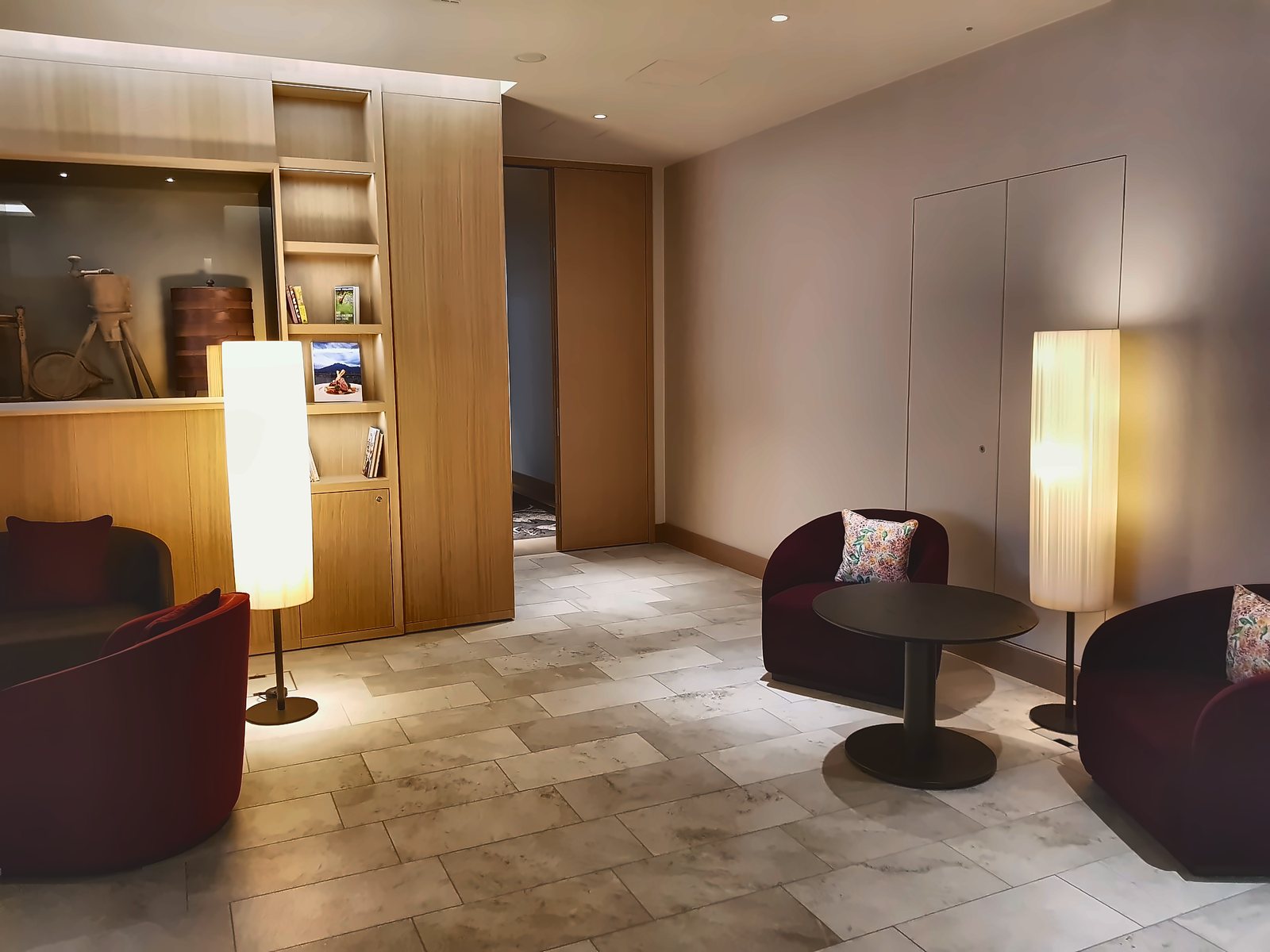 Living area of a Waldhotel Bürgenstock suite with two column floor lamps