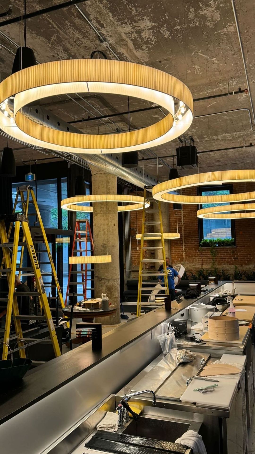 The rings going up in an already-finished room, between the ladders and the covered steel counter