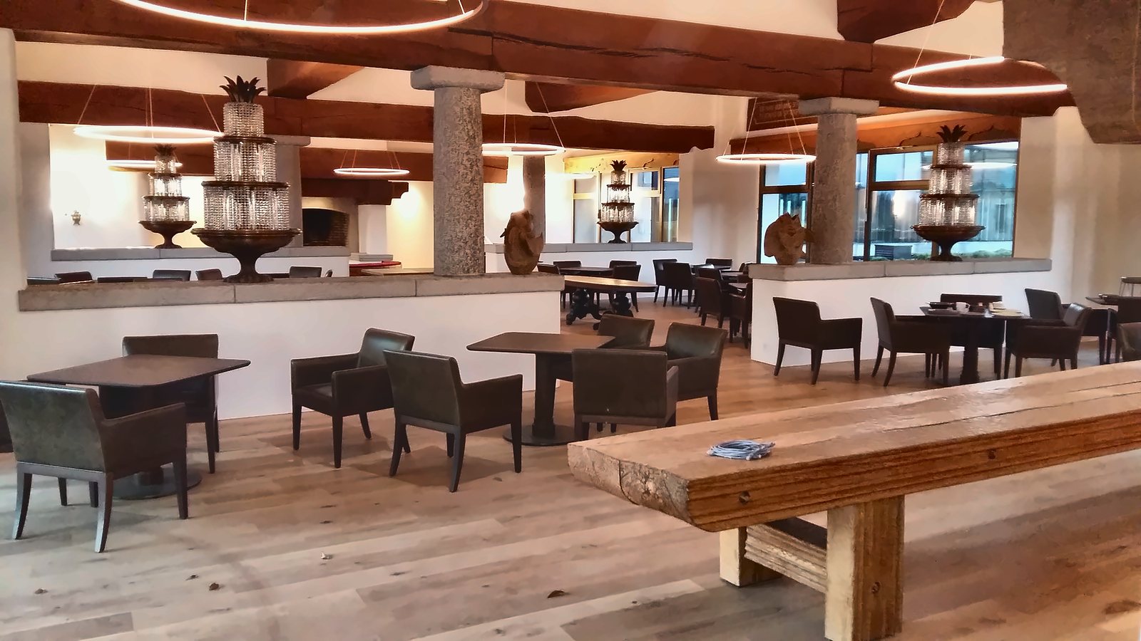 The Alpine Spa restaurant with luminous rings suspended below the beams