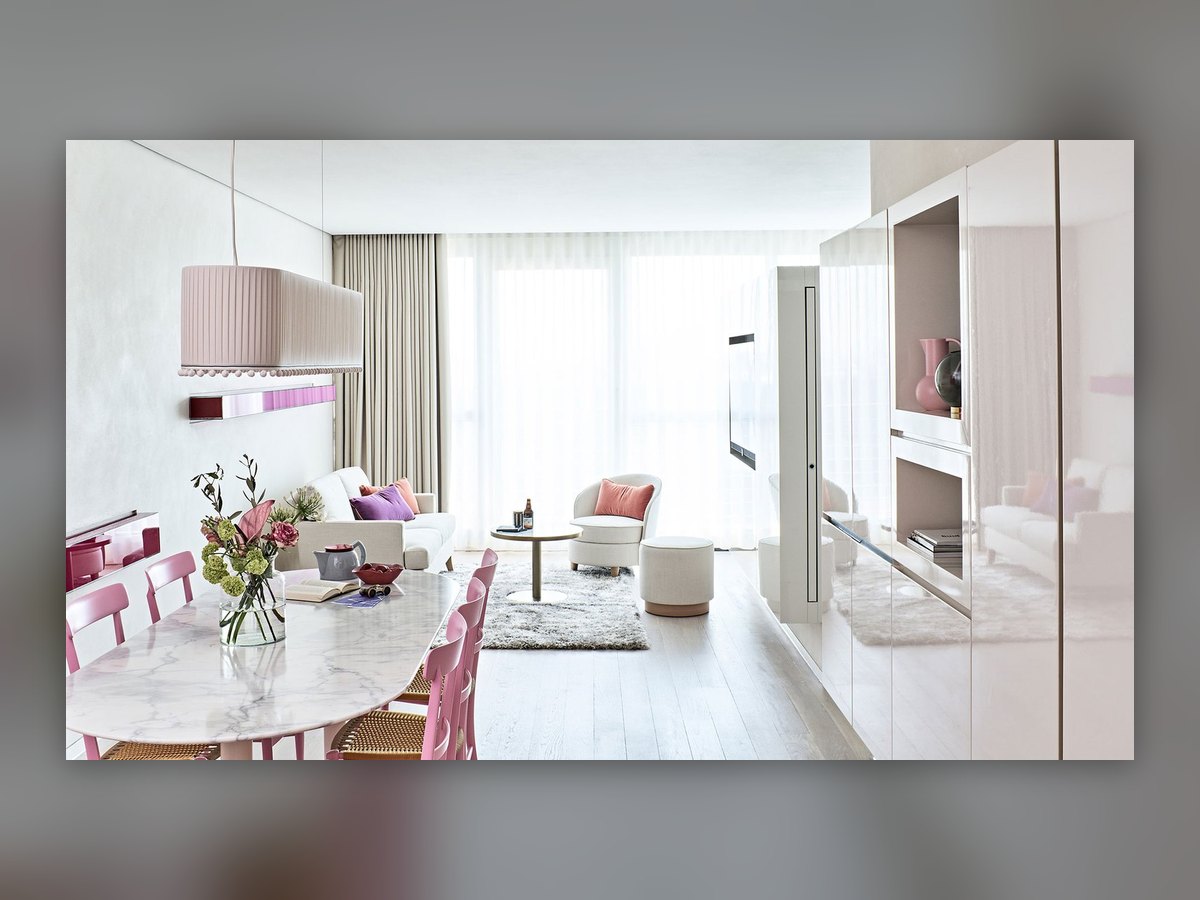 Rectangular pleated fabric pendant above the marble table of a SIDE Hotel suite