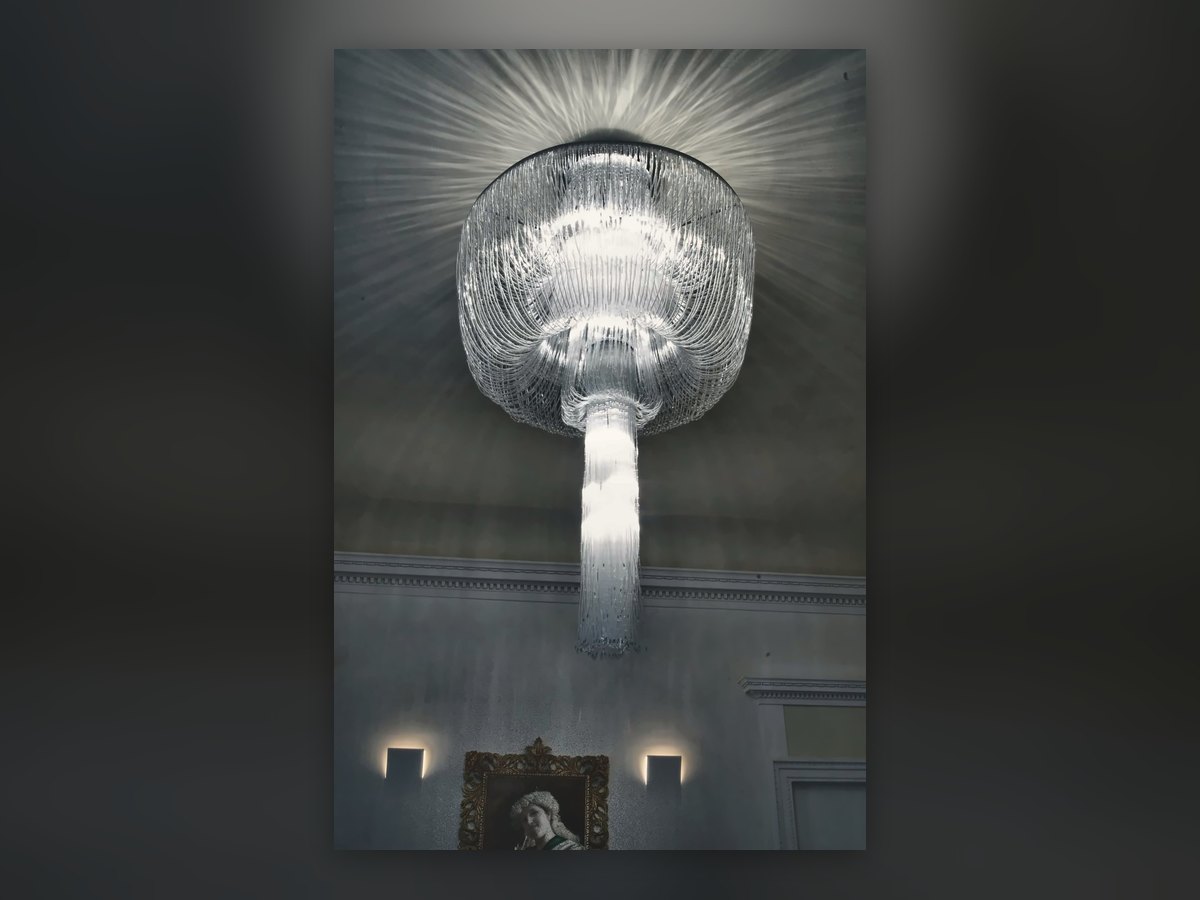 Glass-cane dome ceiling light with its wash of light across the ceiling