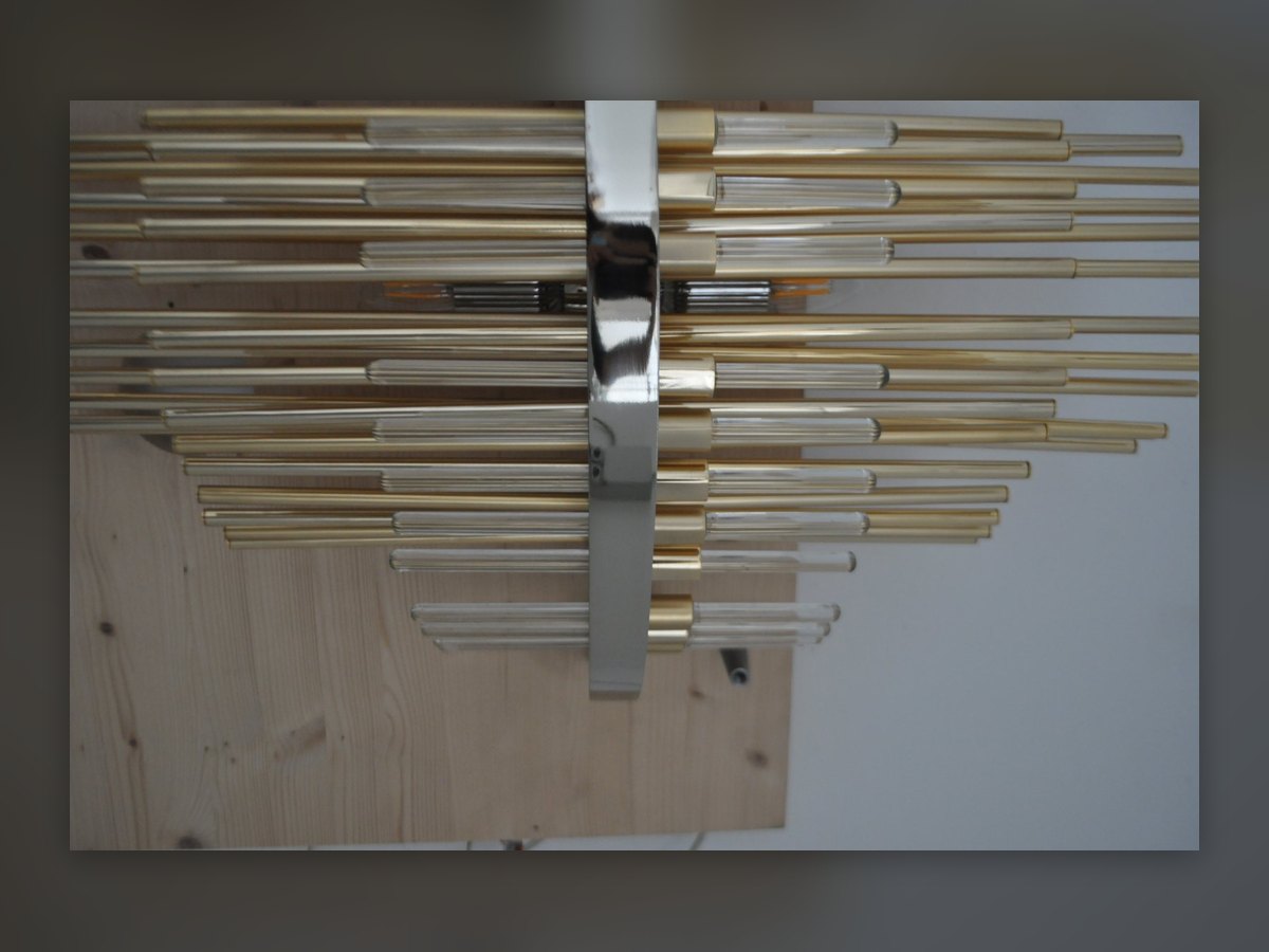 The gilded rods mounted on a test panel, with the chromed bracket at the centre