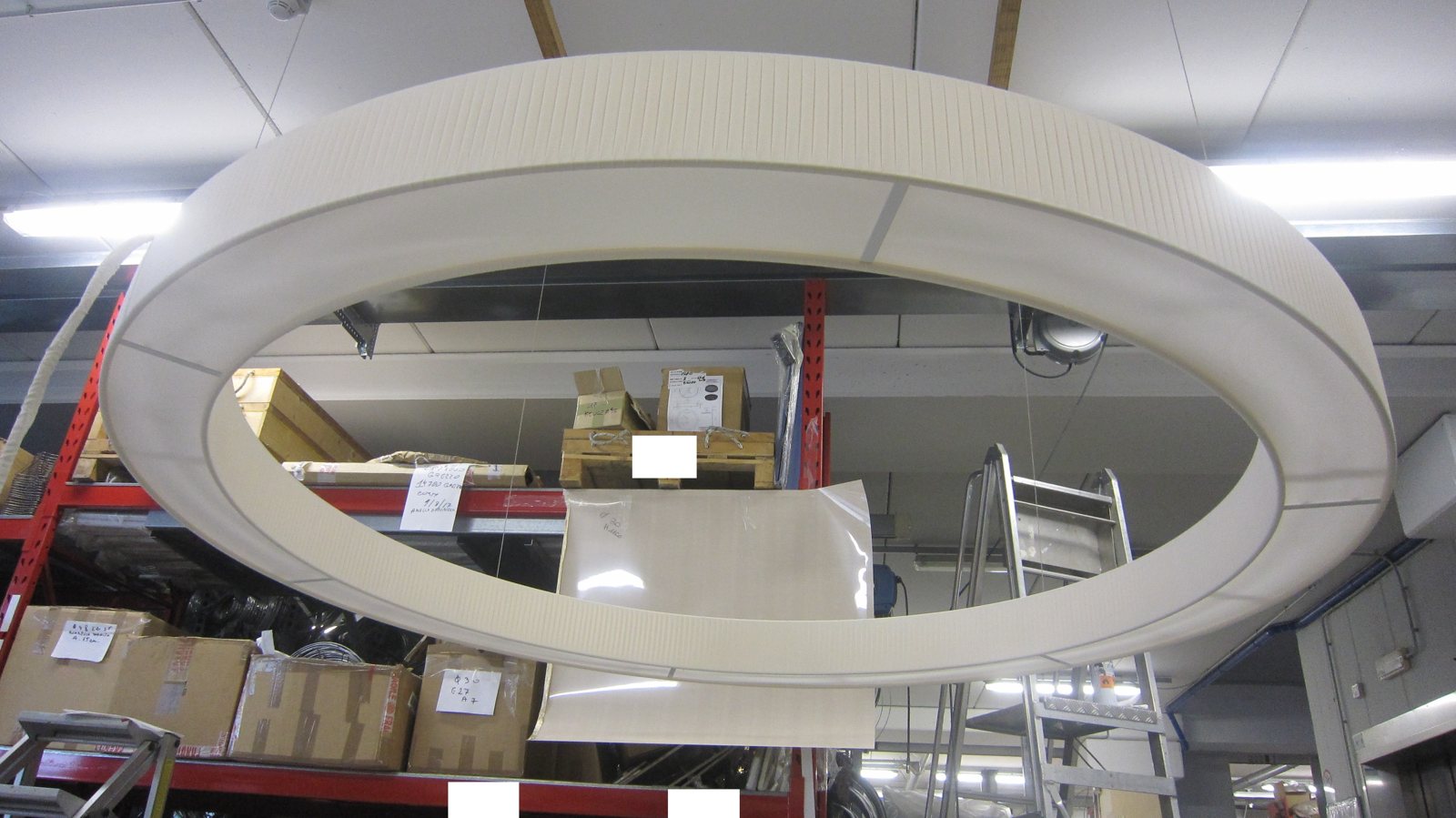 Production sample of an EVA ring shade hung in the workshop